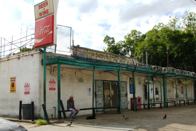Big Daddy's supermarket on Bexar Street stands as a monument to squalor amid the positive...