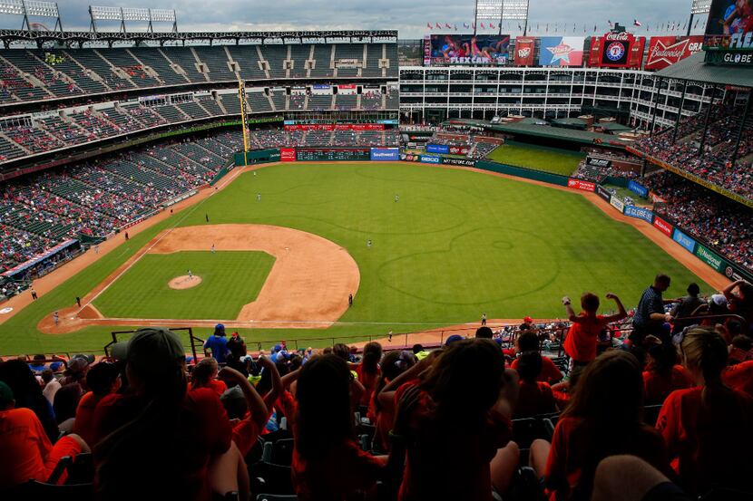 Dark circles in the outfield were left over from an off-season golf game at Globe Life Park...