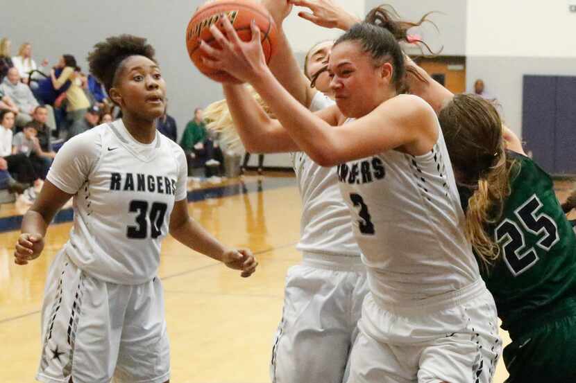 Frisco Lone Star's Mallory Adams (3) grabs a rebound against Frisco 
Reedy on January 9,...