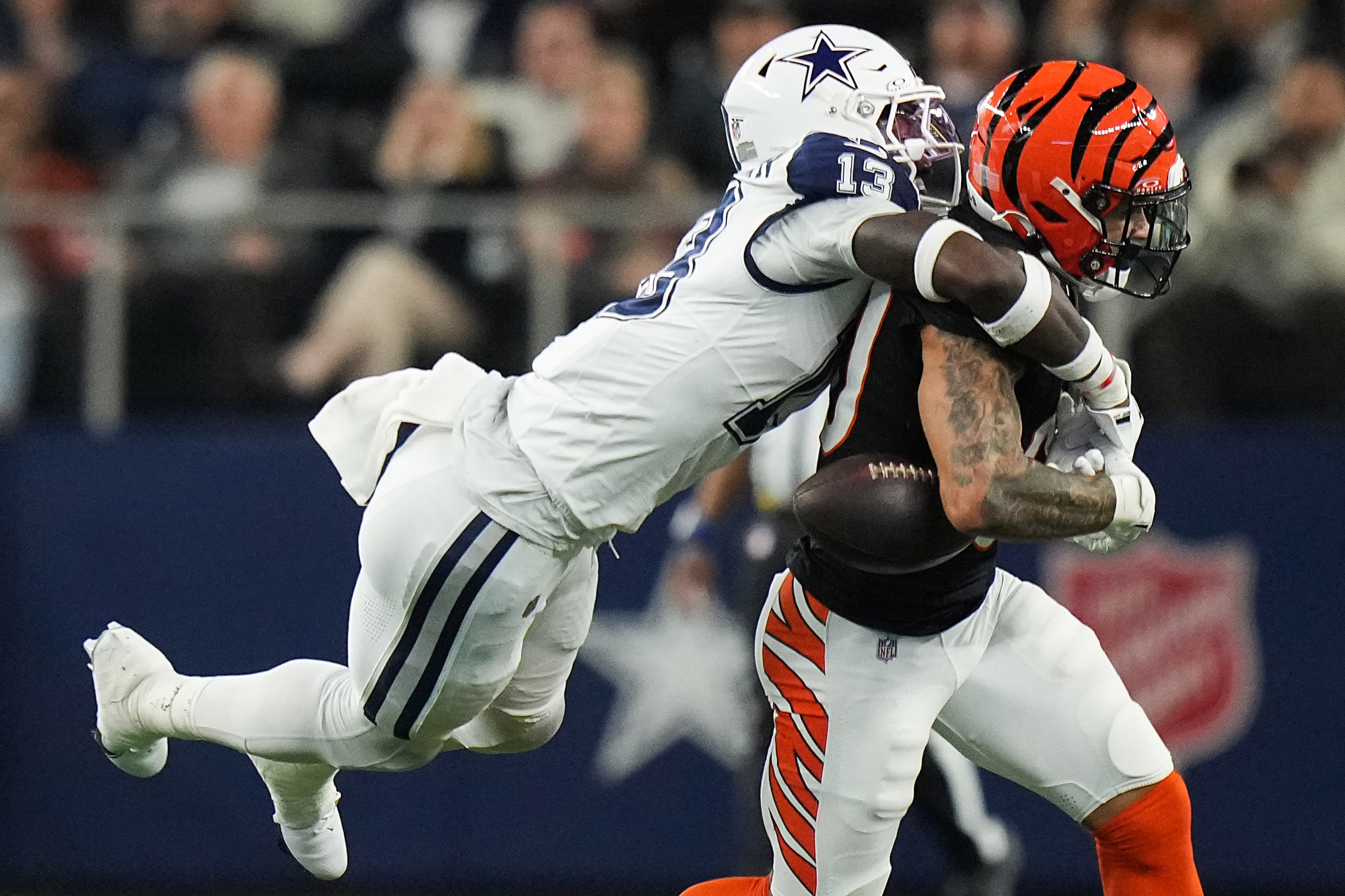 Dallas Cowboys linebacker DeMarvion Overshown (13) breaks up a pass intended for Cincinnati...