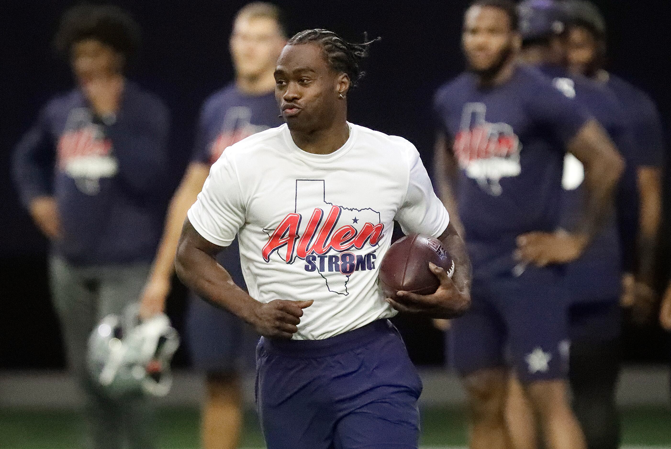 Wide receiver Brandin Cooks runs with the football as the Dallas Cowboys held mini camp at...