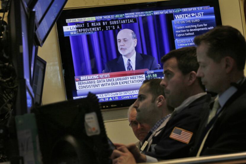 A television screen on the floor of the New York Stock Exchange shows Federal Reserve...