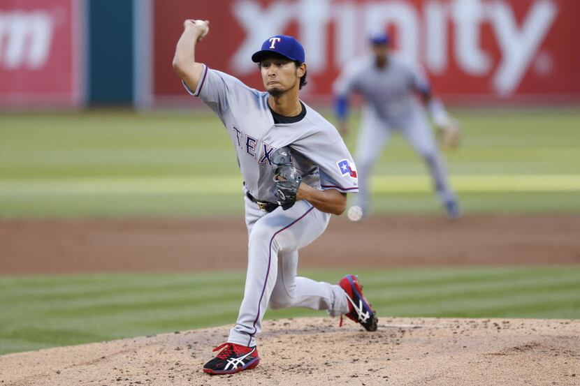 Jun 17, 2014; Oakland, CA, USA; Texas Rangers starting pitcher Yu Darvish (11) pitches...