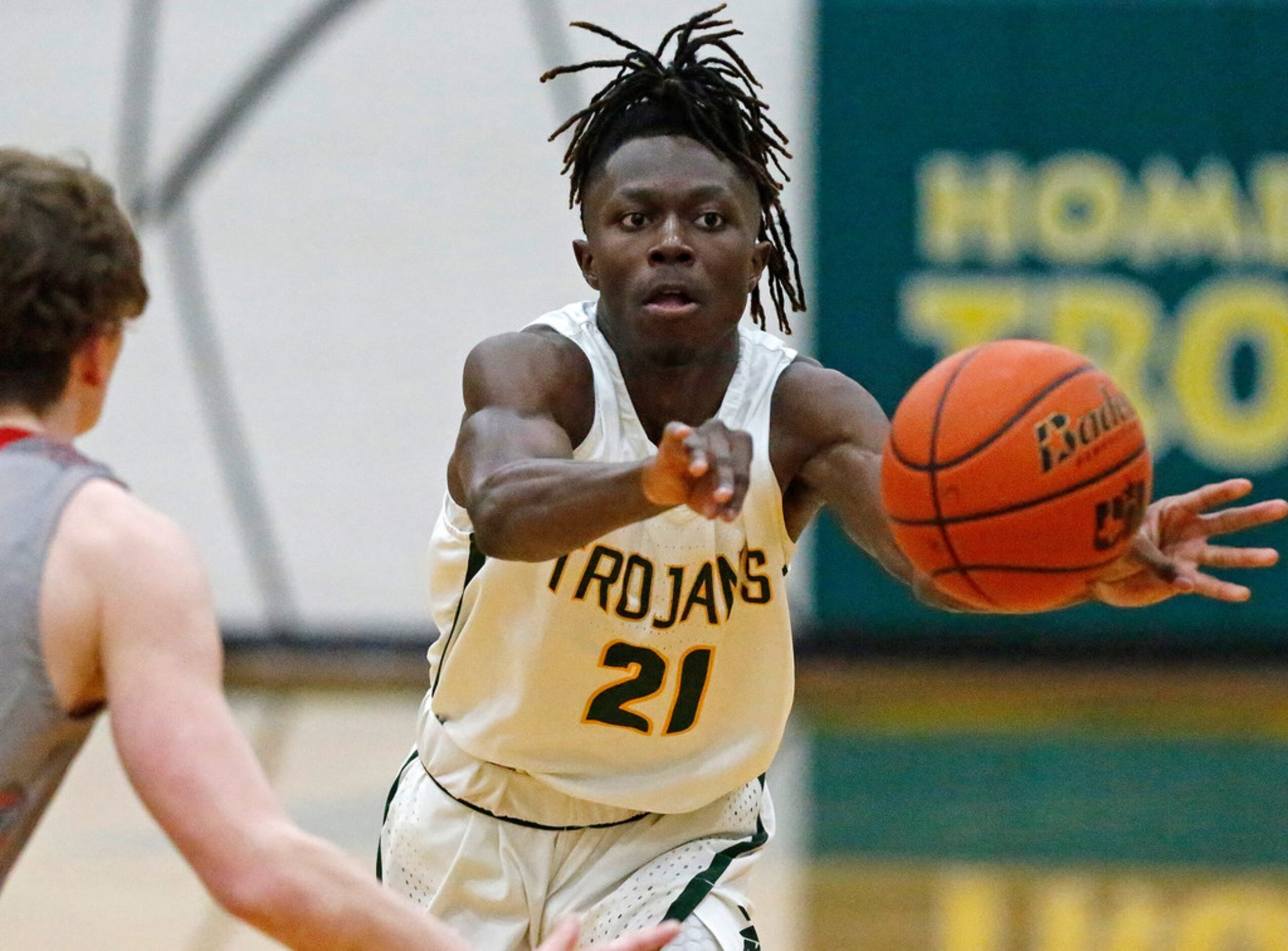 Newman Smith High School guard A.J. Bar-Jona (21) passes the ball during the first half as...