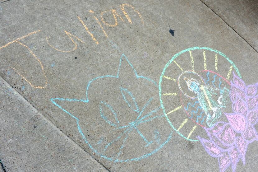 Chalk drawings on the sidewalk at Buzz Brews' Deep Ellum location, which was one of four...
