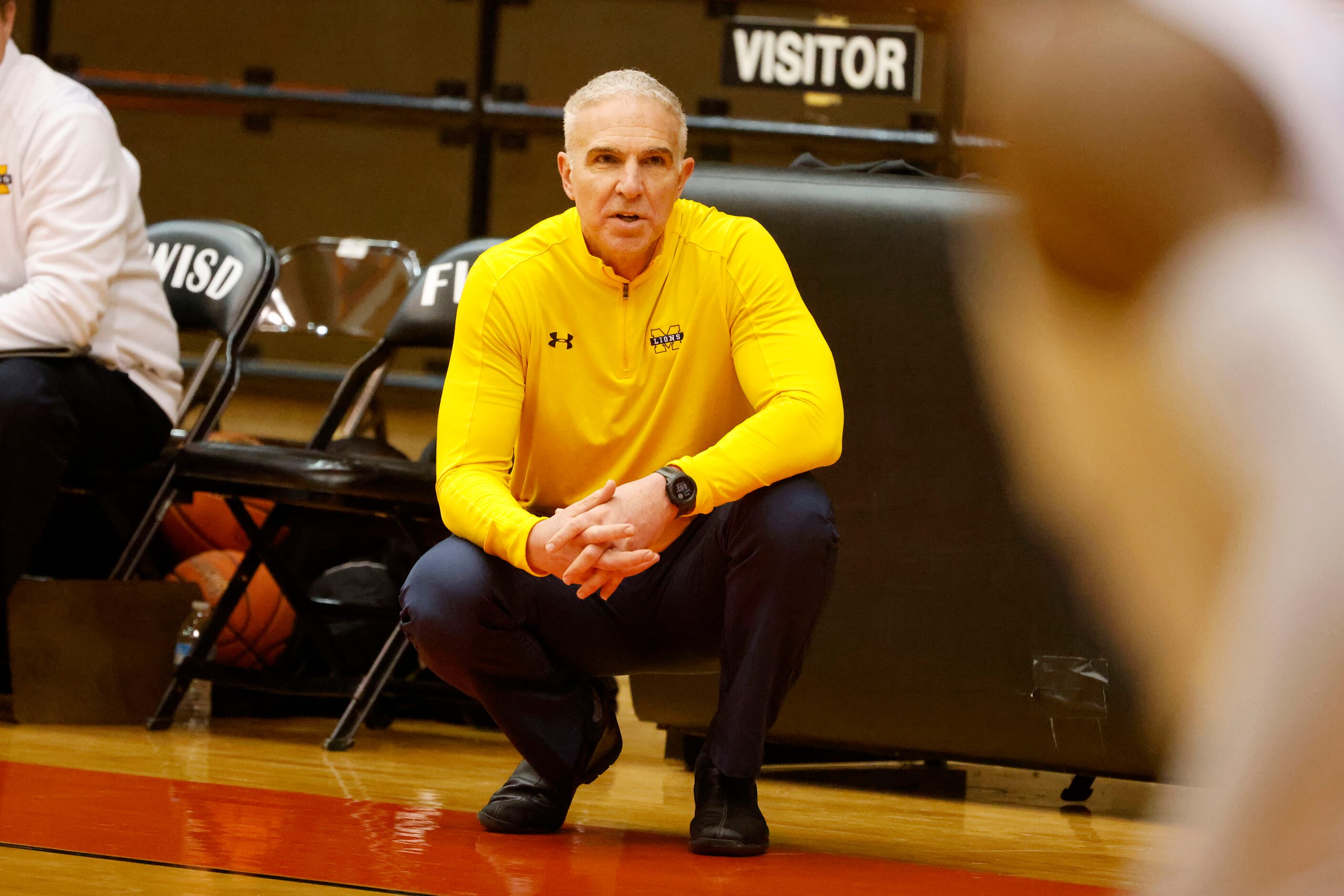 McKinney head coach Wes Watson watches his team play North Crowley during the first half of...