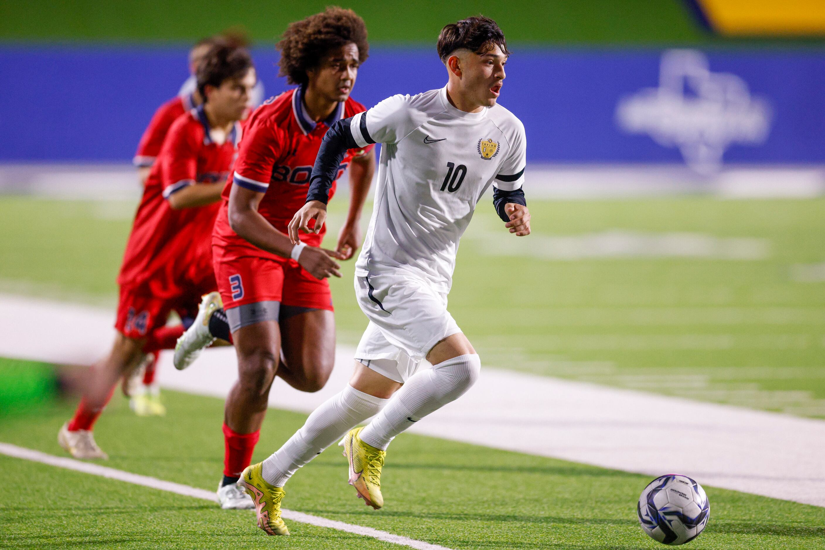 Irving’s Milton Lopez (10) dribbles the ball away from McKinney Boyd defender Caleb Sempebwa...