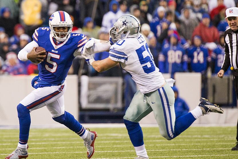 Buffalo Bills quarterback Tyrod Taylor (5) commits a facemask penalty against Dallas Cowboys...