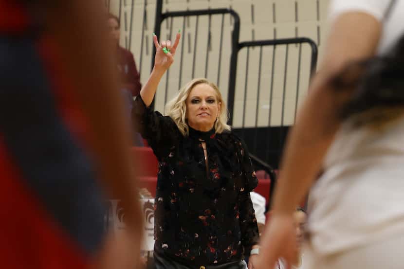Mansfield Timberview coach Kit Kyle Martin signals a play to her players during a 64-44...
