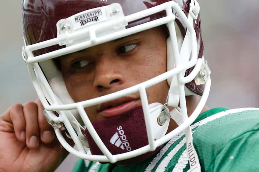 Mississippi State Maroon quarterback Dak Prescott removes his helmet after playing against...