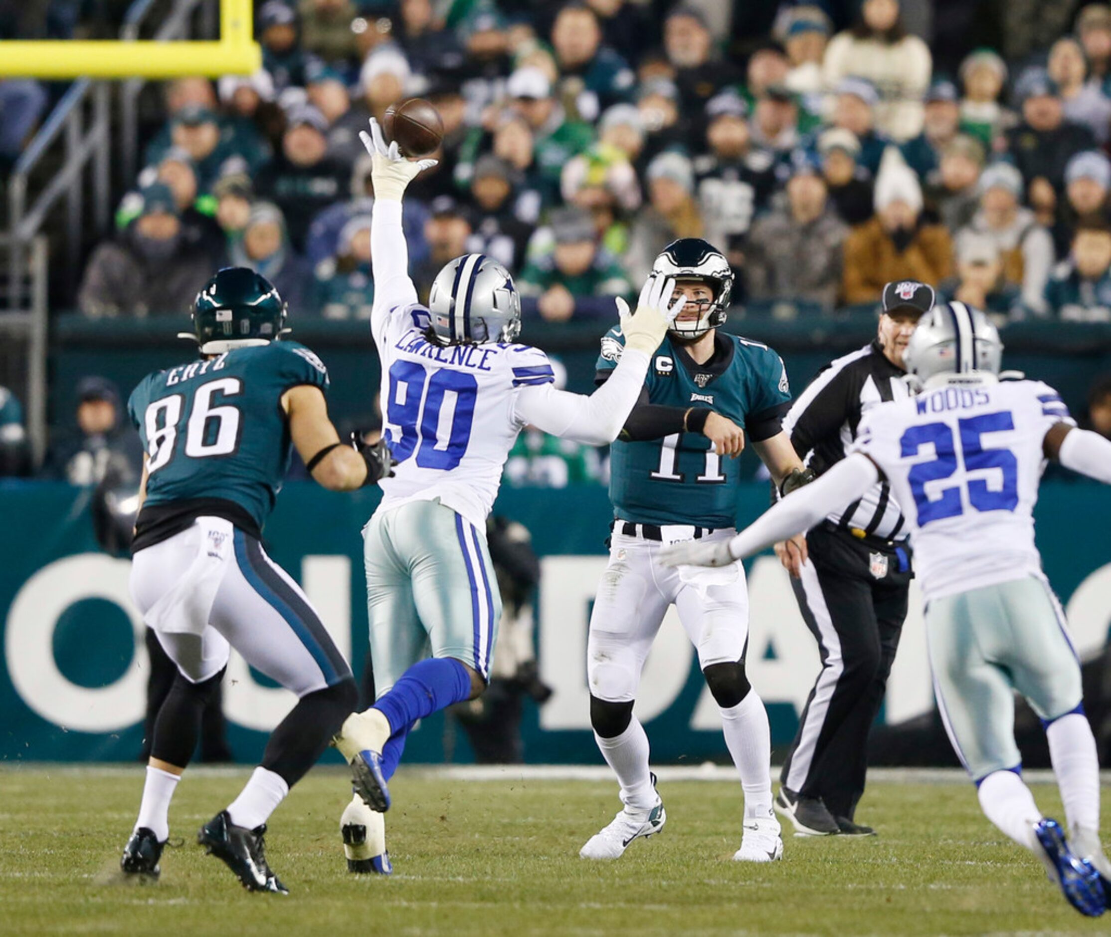 Dallas Cowboys defensive end Demarcus Lawrence (90) deflects a pass from Philadelphia Eagles...