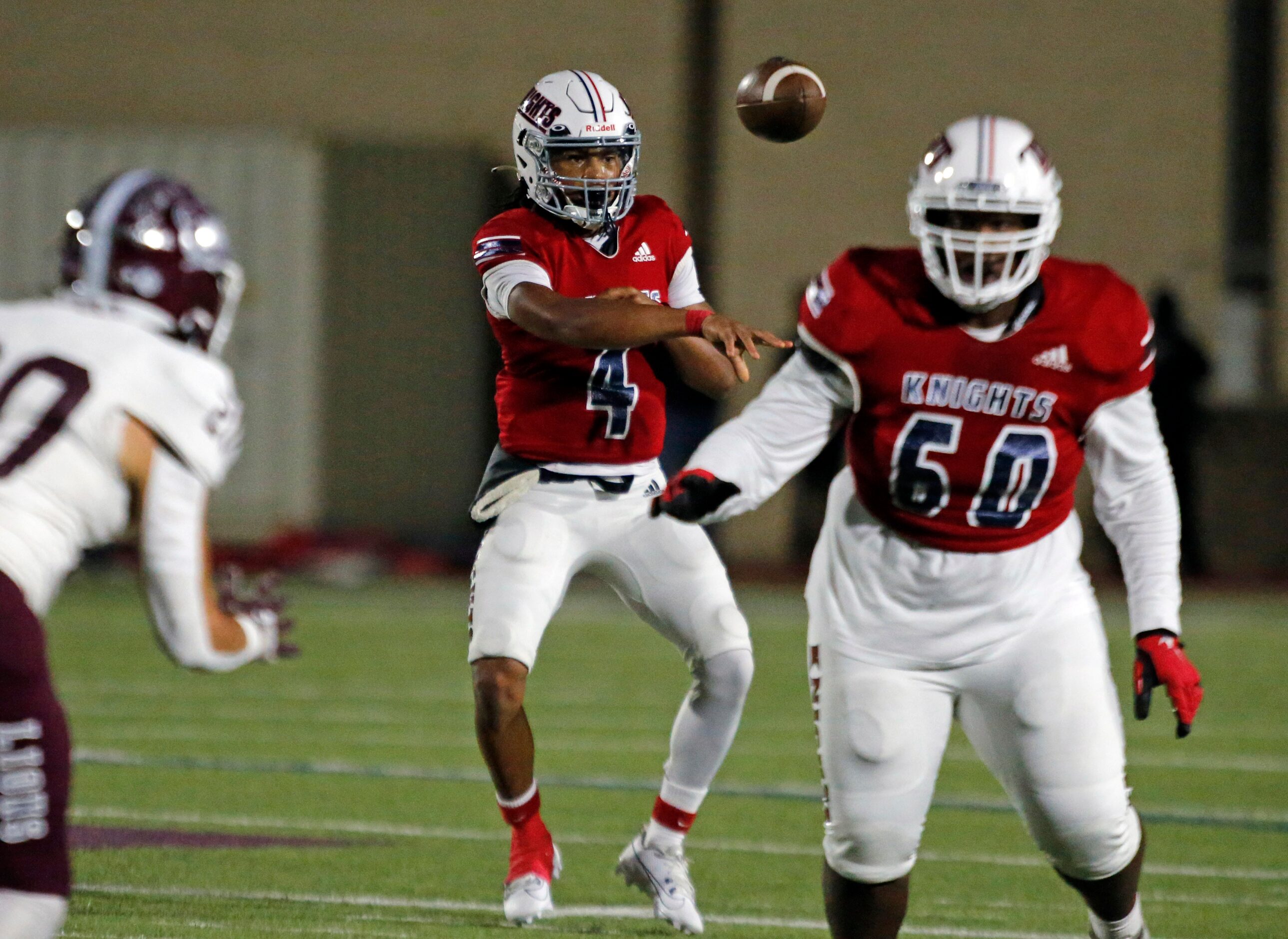 Kimball QB Armirie Williams-Hall (4) shovels off a pass during the first half of a high...