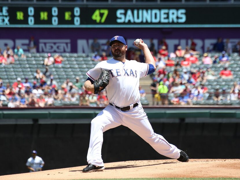 ARLINGTON, TX - JUNE 8: Joe Saunders #47 of the Texas Rangers throws in the first inning...