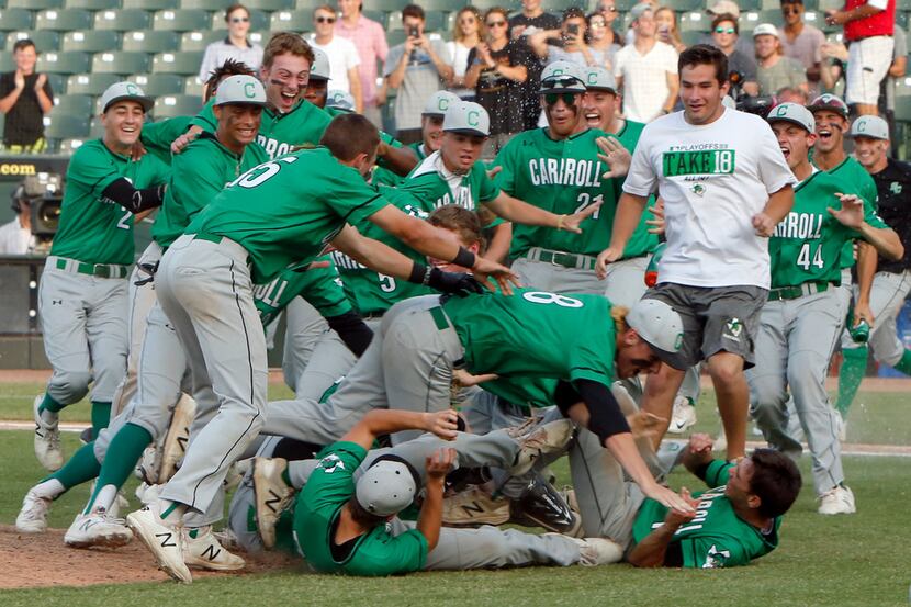 Southlake Carroll players engage in a major league doggrel near the mound following their...