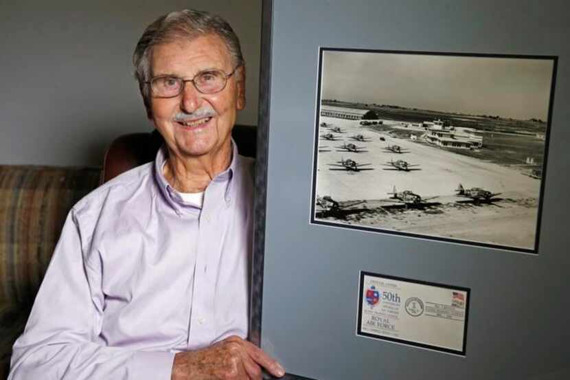 
Eric Gill, 90, of Lake Highlands shows a photo of the first British Flying Training School...