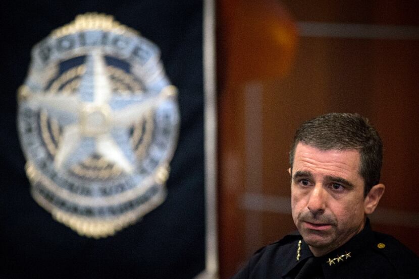 David Pughes, interim chief of police for the Dallas Police Department, talks to reporters...