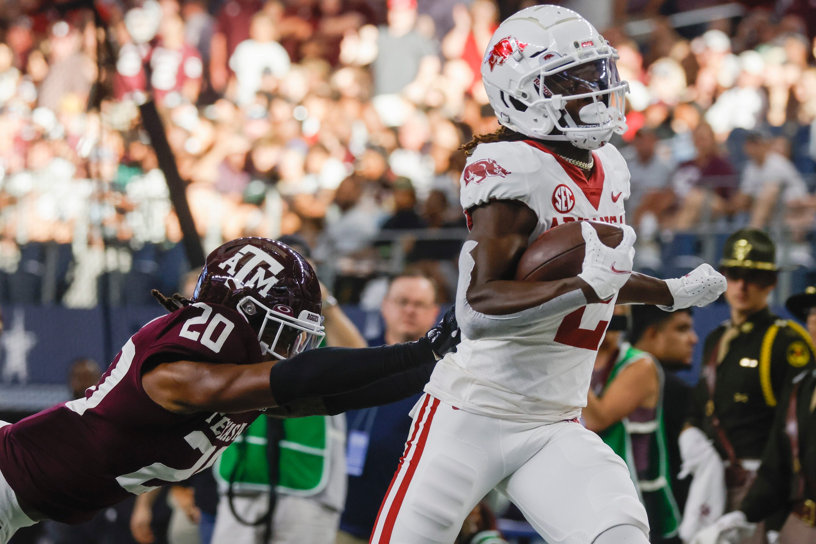 Arkansas wide receiver Ketron Jackson Jr. (2) gets tackled by Texas A&M defensive back...