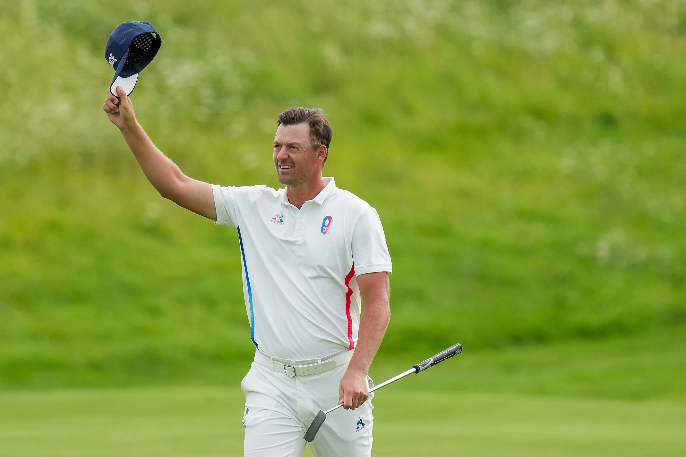 Victor Perez of France waves to the crowd during the final round of men's golf at the 2024...