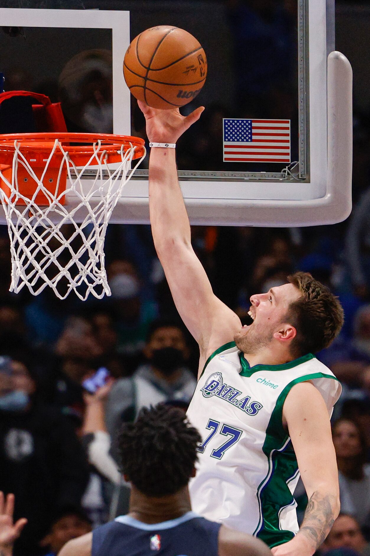 Dallas Mavericks guard Luka Doncic (77) attempts a layup during the fourth quarter against...