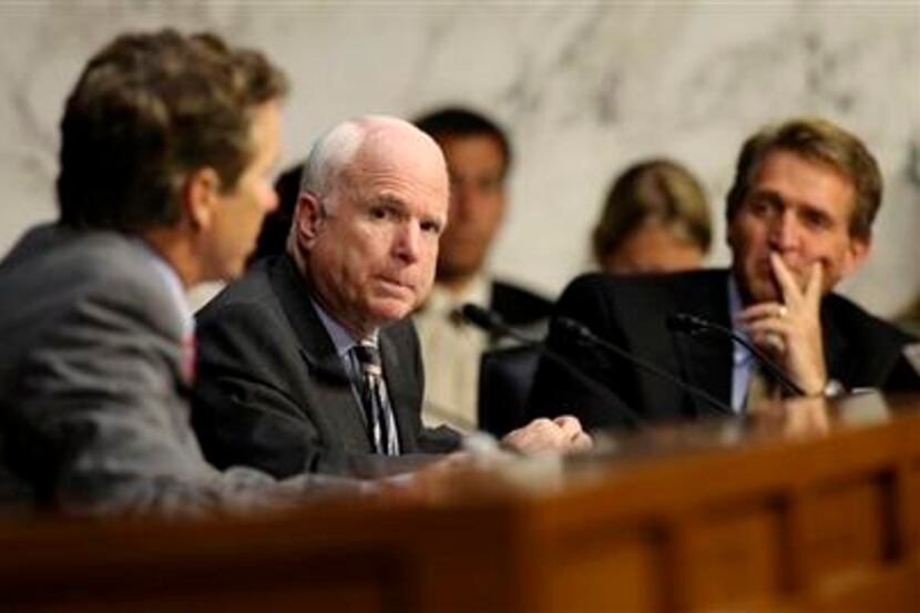 Senate Foreign Relations Committee members Sen. John McCain, R-Ariz, center, and Sen. Rand...