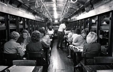 This 1983 file photo shows diners eating dinner in the trolley at Spaghetti Warehouse in...