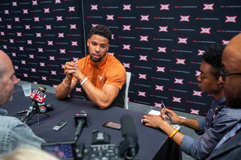 University of Texas football safety Brandon Jones speaks with reporters during the breakout...