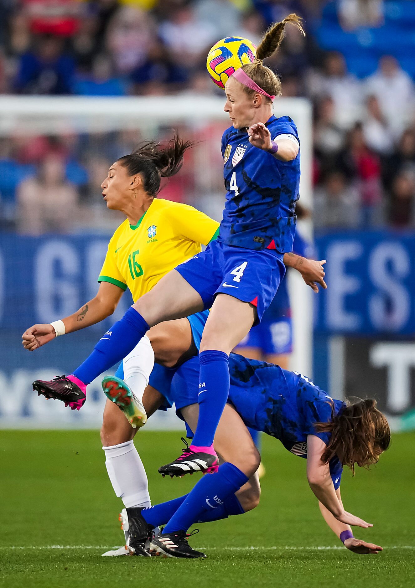 United States defender Becky Sauerbrunn (4) challenges Brazil forward Bia Zaneratto (16) for...