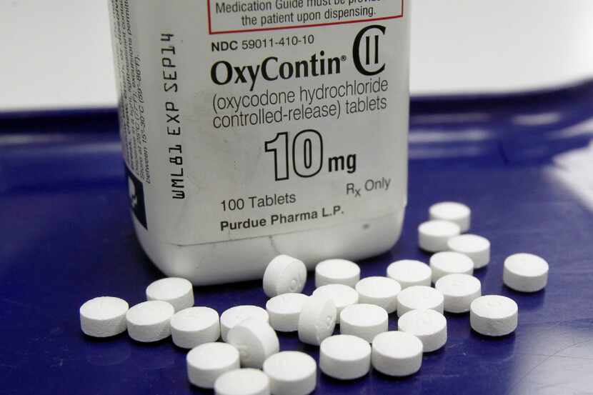 FILE - This Feb. 19, 2013, file photo, shows OxyContin pills arranged for a photo at a...