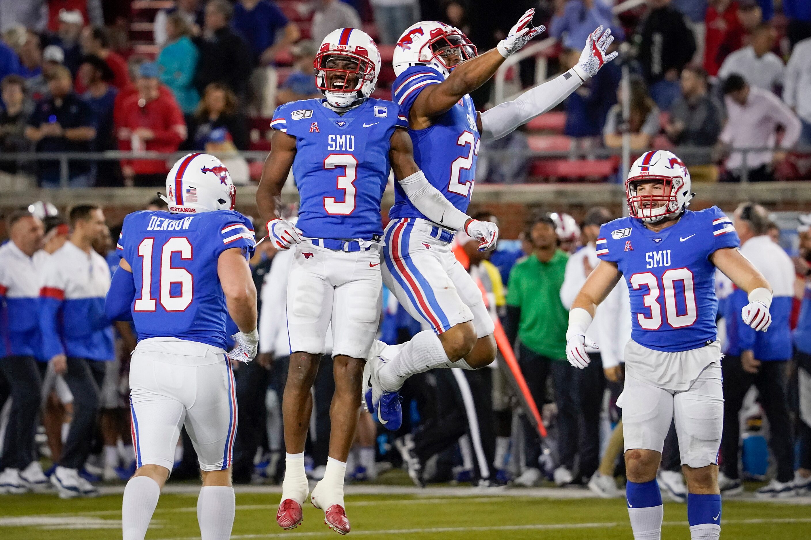 SMU wide receiver James Proche (3) celebrates with safety Rodney Clemons (23) after Proche...