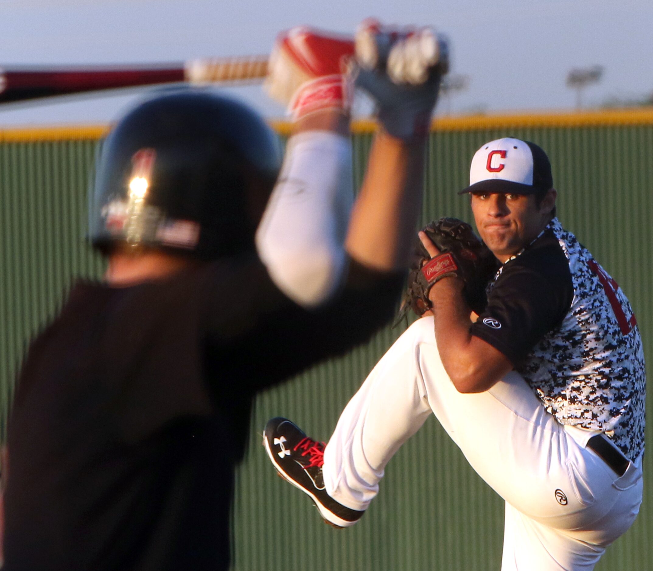 Carrollton Creekview pitcher Brandon White (15) eyes a Dallas Hillcrest batter before...