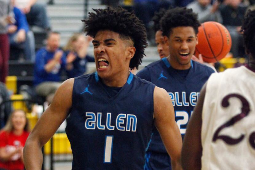 After a steal and a dunk, Allen forward Cam Christon (1) gets pumped up during the first...