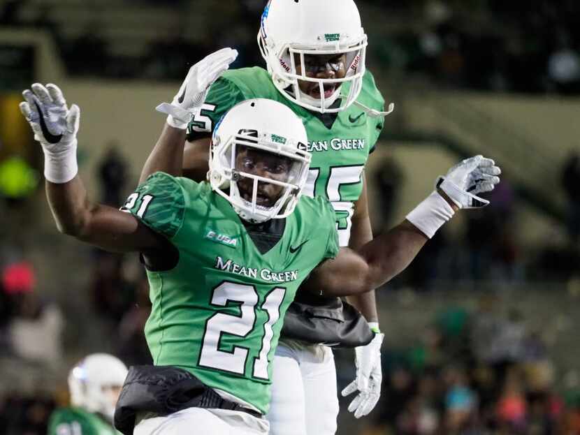 North Texas freshman running back Nic Smith (21) celebrates after he scores a touchdown...