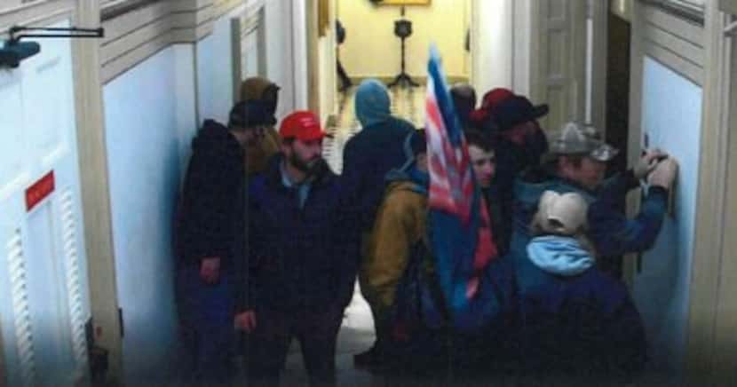 Kerry Wayne Persick, in red cap, inside the U.S. Capitol building on Jan. 6, 2021.