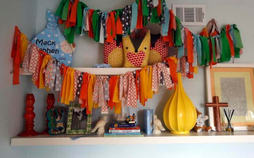 
The fabric banner hanging in the nursery was made by a friend for Mack's baby shower....