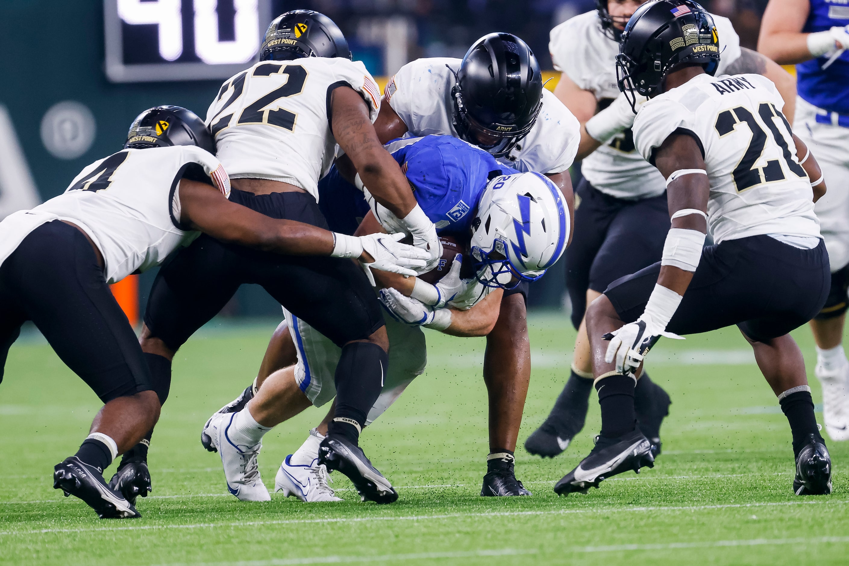 Air Force Falcons running back Brad Roberts (20) is stopped by the Army Black Knights...