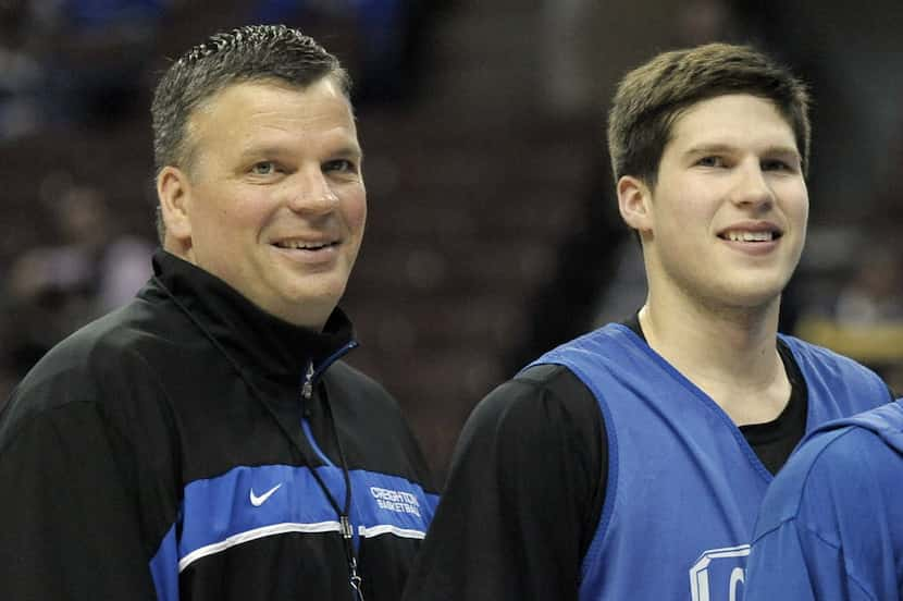 Creighton head coach Greg McDermott, left, and his son Doug McDermott pose for a team photo...