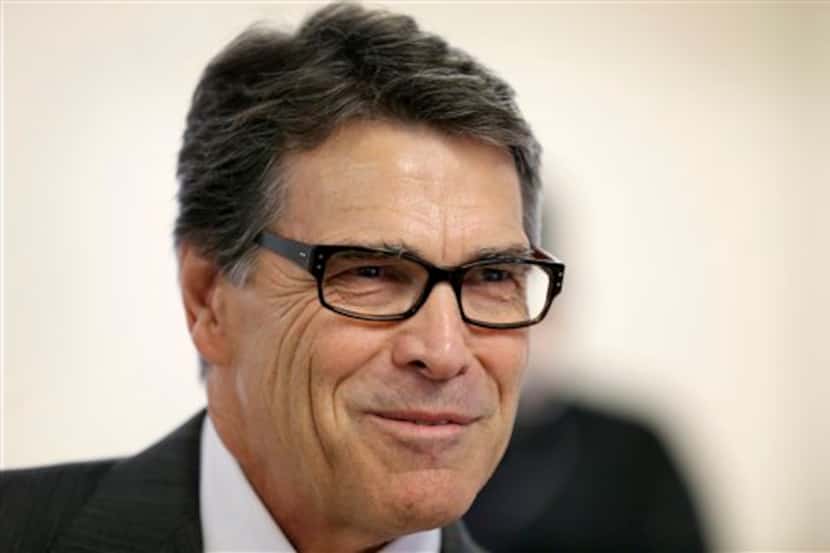 Gov. Rick Perry speaks to local residents while campaigning for 1st Congressional District...