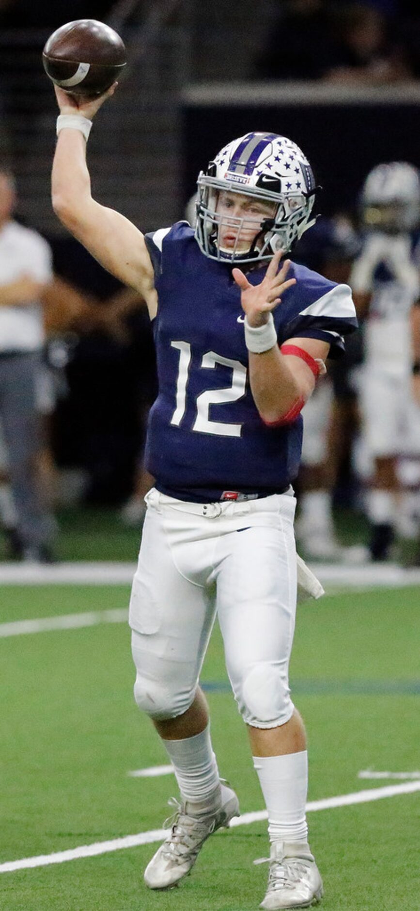 Richland High School quarterback Drew Trent (12) throws a pass during the second half as...