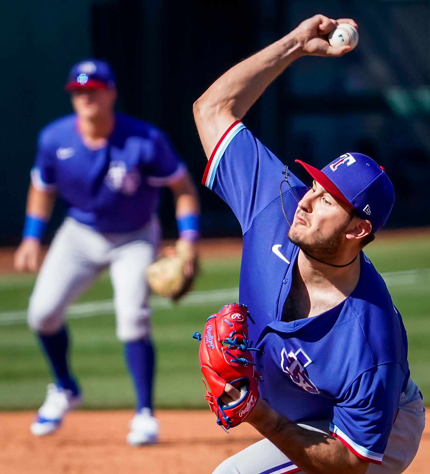 Texas Rangers pitcher Joe Gatto delivers during the fifth inning of a spring training game...