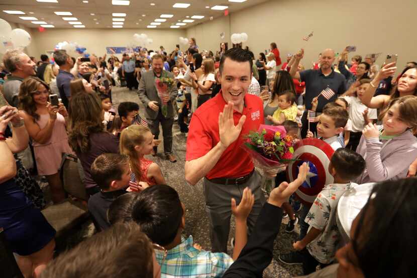 Tom Scott greets supporters during an Olympics sendoff party at The Westin Galleria in...