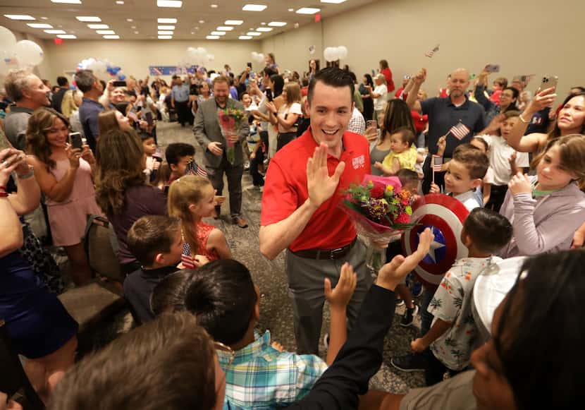Tom Scott greets supporters during an Olympics sendoff party at The Westin Galleria in...