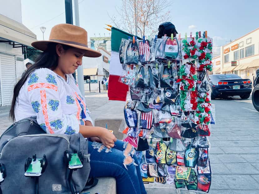 Street vendor Patricia Ramirez at the international bridge in El Paso. She said her sales...