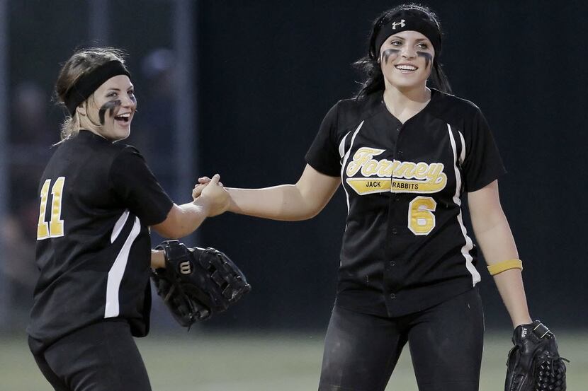 Forney's Brooke McCarroll (6) is congratulated by teammate Taylor Leflore (11) after making...