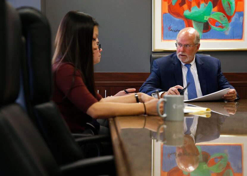 SettlePou co-founder John D. "Jay" Settle talks with Rebekah Wilson, a legal secretary, as...