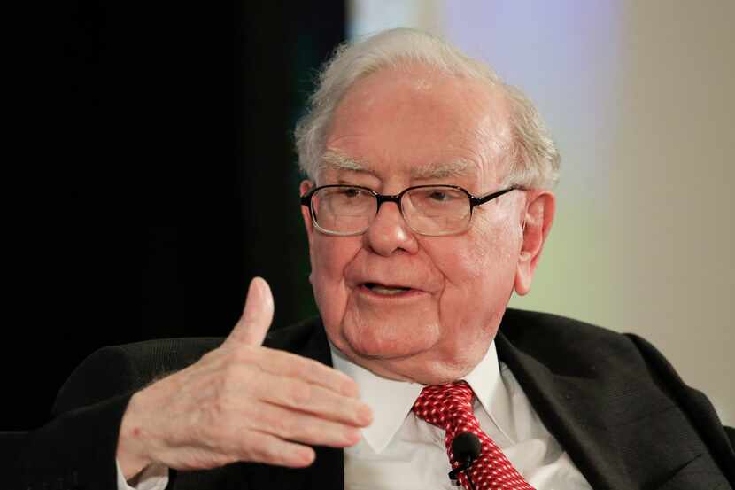 FILE - In this Oct. 3, 2017, file photo, investor Warren Buffett gestures on stage at a...