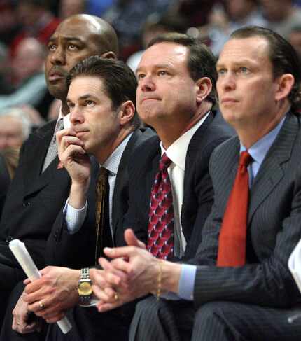 Tim Jankovich (second from left) is pictured with Kansas coach Bill Self (second from right)...