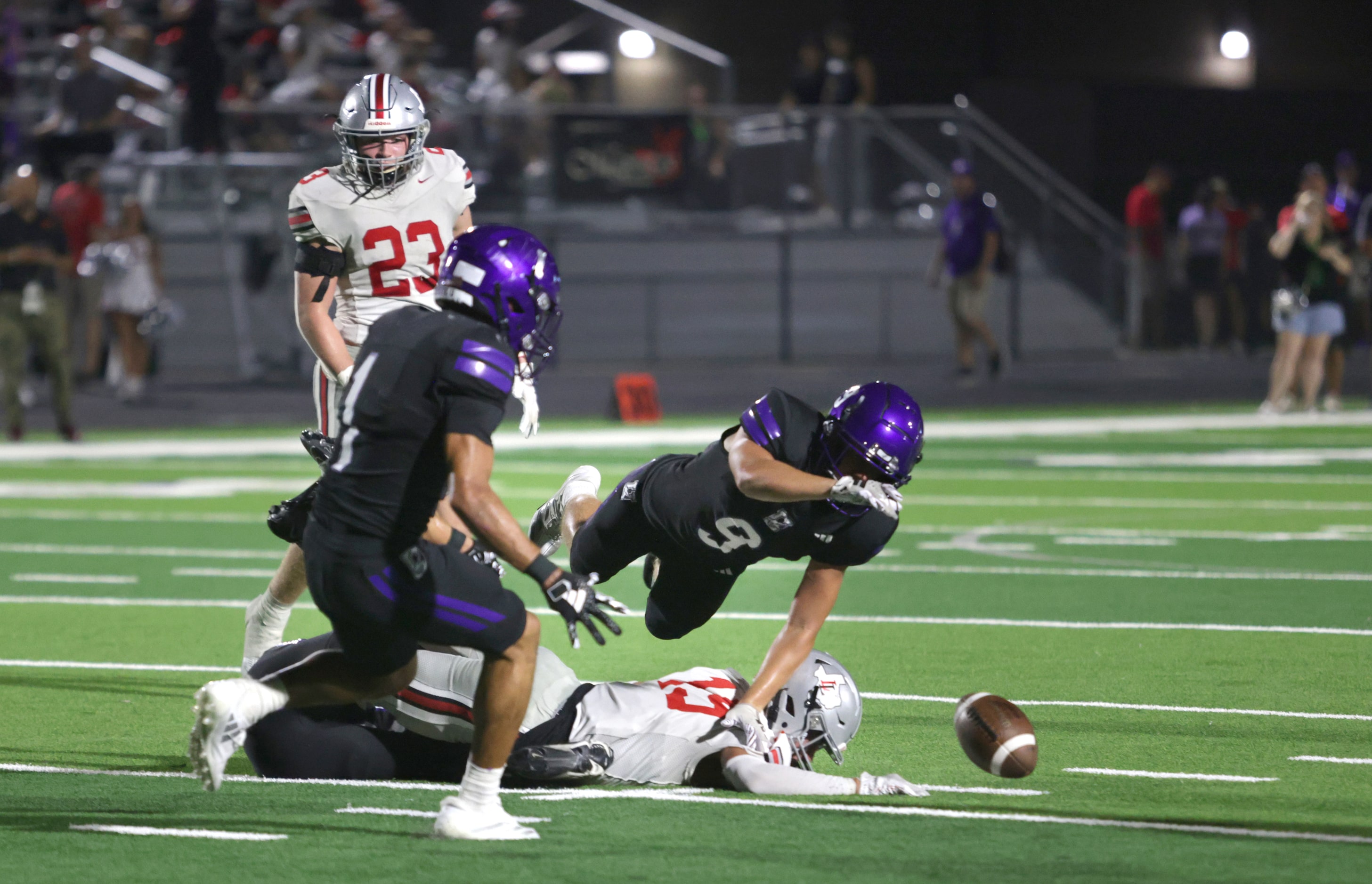 Boths teams struggle to gain control of the ball after a failed field goal attempt during...