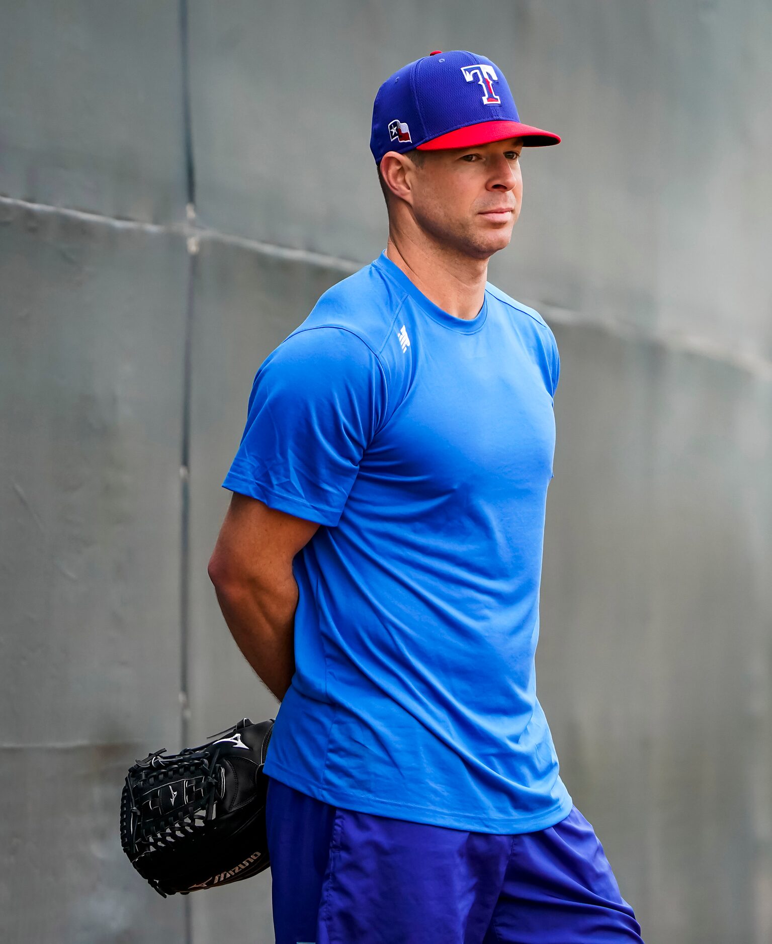 Texas Rangers pitcher Corey Kluber watches teammate Kyle Gibson throw in the bullpen on the...