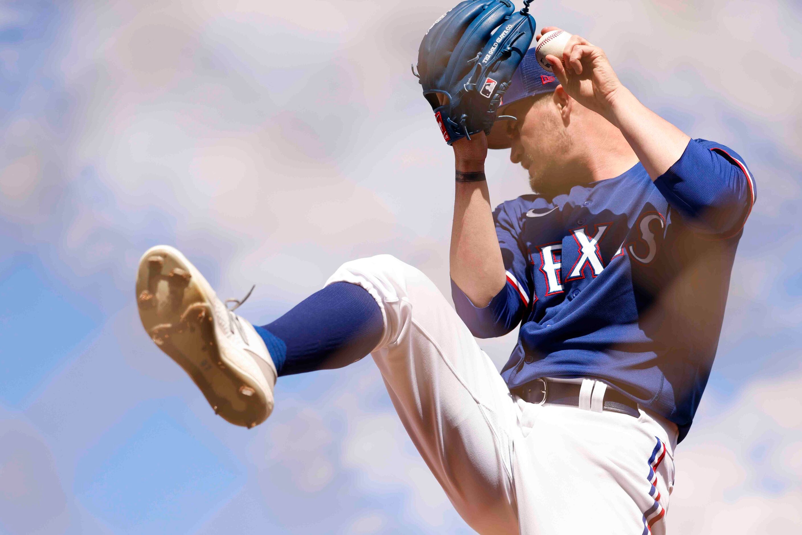 Texas Rangers pitcher Andrew Heaney throws a pitch during a spring training workout at the...