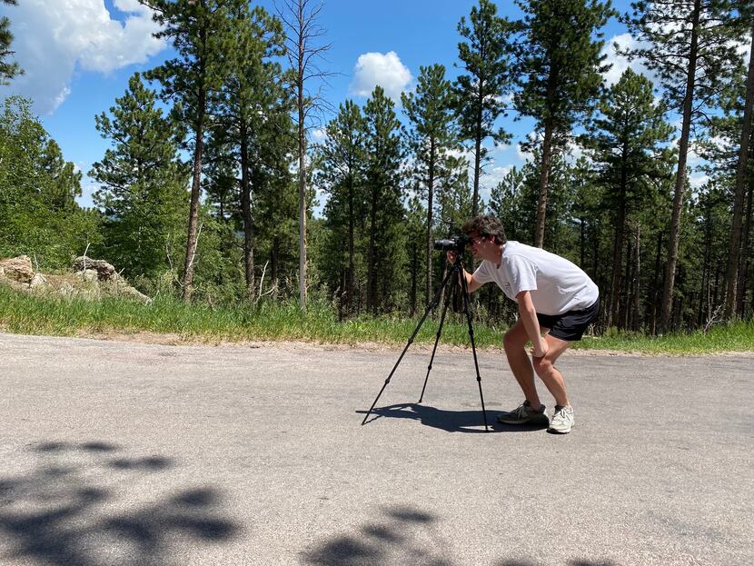 Cooper takes photos of Mount Rushmore from Iron Mountain Road in Keystone, S.D., the week of...